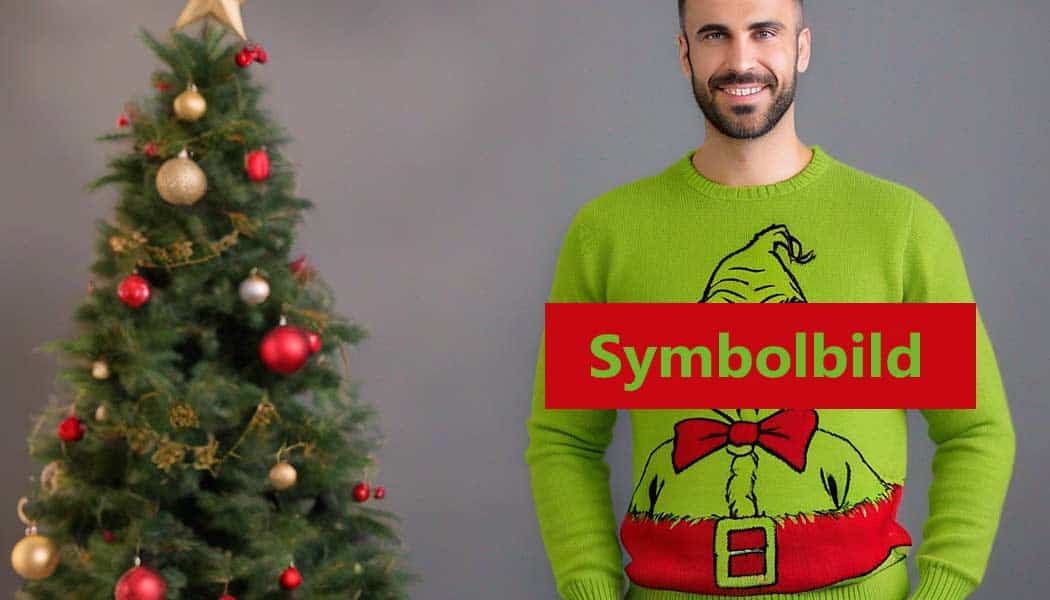 Weihnachtspullover mit Grinch Motiv für einen Mann (NF)